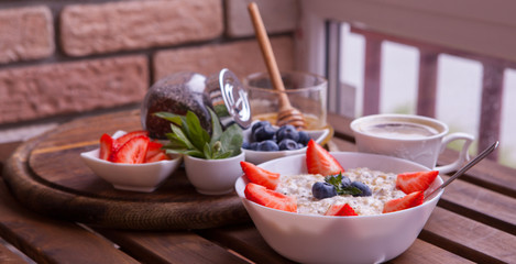 Healthy Homemade Oatmeal with Berries for Breakfast. Fitness food.