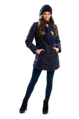 Woman in navy down jacket. Black ankle boots and scarf. New winter apparel. Outerwear with warm lining.