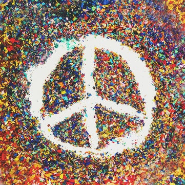 Peace symbol on scraps of colorful pastel oil colors 