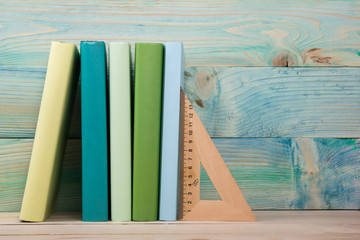 Fototapeta na wymiar Back to school. Stack of colorful books on wooden table. Copy space