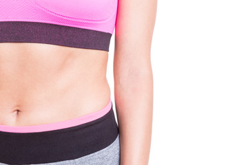 Close-up of sporty abs of woman wearing bustier