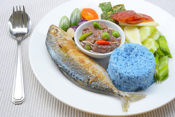 Rice with fried mackerel, boiled egg, shrimp paste, chilli sauce and vegetables, original Thai food.
