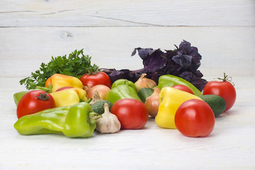 Summer vegetables on white wooden table