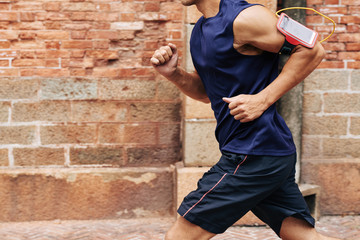 Cropped image of man getting ready to marathon