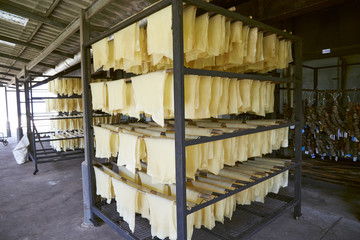 Rubber sheets hanging on the racks.   © creativesunday