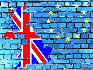Britain and the EU -
The map of Great Britain in the national colors in front of a blue brick wall with the European circle of stars.
