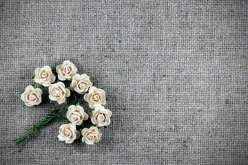 bouquet of paper roses on burlap, postcard, background, with cop