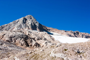 view of the glacier and the rocks of Caucasus peaks, blue sky, l