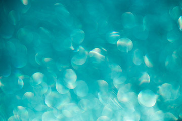 bokeh on turquoise background, blur