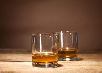 Whiskey on wooden background