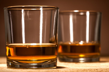Whiskey on wooden background