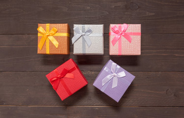 Gift boxes are on the wooden background with empty space