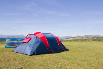 Tent with a view, overlooking Cardigan Bay and Snowdonia mountains in Wales,UK