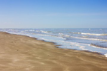 A peaceful landscape of the sea meeting the shoreline.