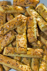 baked puff cheese sticks with caraway seeds closeup