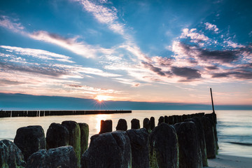 Wooden poles breaking sea water, long exposure. Poland, Baltic, Ustronie Morskie. © cegli