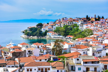 Fototapeta premium Skyathos island panorama with white houses and small pedestrian