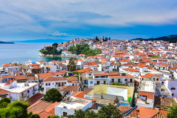 Naklejka na ściany i meble Skyathos island panorama with white houses and small pedestrian