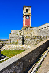 The clock tower of the old fortress in Corfu Town on top of the