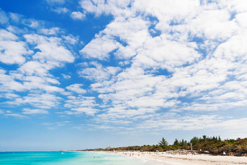 Tourists relax on Varadero sandy beach. Cuba.