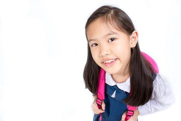 Portrait of asian child in school uniform with school bag on white background isolated