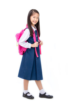 Portrait of asian child in school uniform with school bag on white background isolated