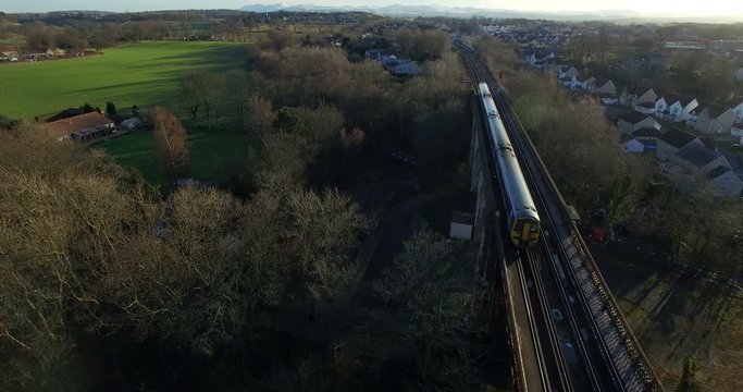 Aerial: Train on Forth Rail Bridge in Queensferry, Edinburgh, Scotland