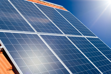 Photovoltaic solar panels on a tile roof