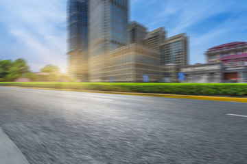 Obraz premium clean asphalt road with city skyline background,china.