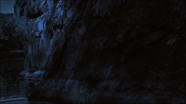 Boat sailing at night in canyon