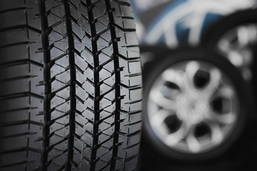 Car wheel closeup, blur background