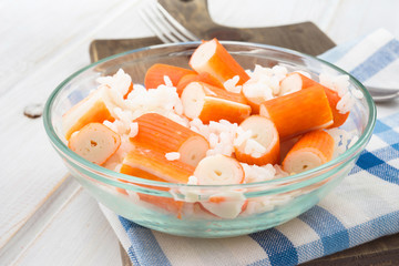 sliced crab sticks in bowl with  rice
