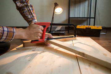 man sawing a board