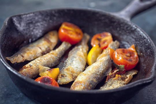 Grilled Fish In Cast Iron Skillet With Cherry Tomato 