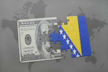 puzzle with the national flag of bosnia and herzegovina and dollar banknote on a world map background.