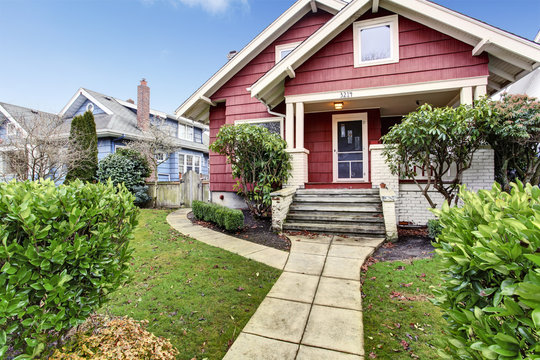 Classic Craftsman Old American House Exterior In Red And White.