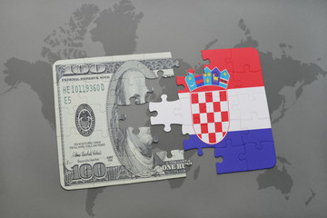 puzzle with the national flag of croatia and dollar banknote on a world map background.