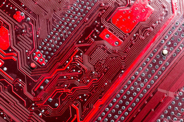 Close up of a printed red computer circuit board