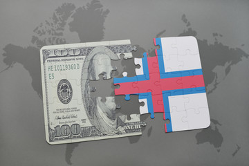 puzzle with the national flag of faroe islands and dollar banknote on a world map background.