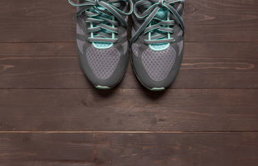 Sneakers is on the wooden background