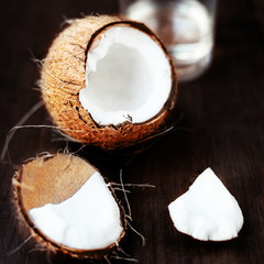 Fresh Coconut over dark wooden background. Close up of coco nut
