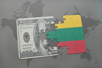 puzzle with the national flag of lithuania and dollar banknote on a world map background.