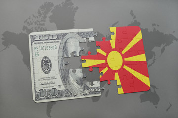 puzzle with the national flag of macedonia and dollar banknote on a world map background.