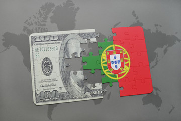 puzzle with the national flag of portugal and dollar banknote on a world map background.