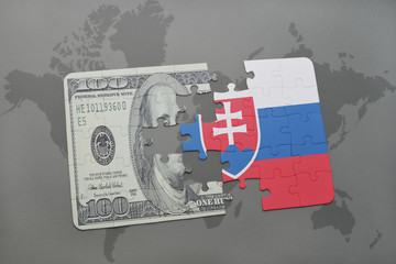 puzzle with the national flag of slovakia and dollar banknote on a world map background.