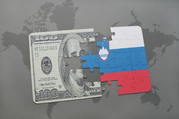 puzzle with the national flag of slovenia and dollar banknote on a world map background.