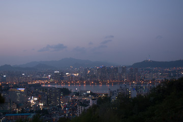 Seoul city with river and mountains in sunset or twilight time