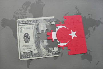 puzzle with the national flag of turkey and dollar banknote on a world map background.
