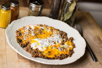 Fried egg with minced meat.