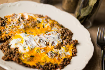 Fried egg with minced meat.